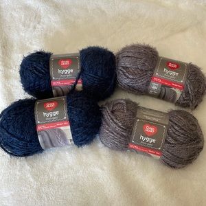 4 skeins red heart hygge yarn. 5 ounce  2 indigo. 2 Sterling.